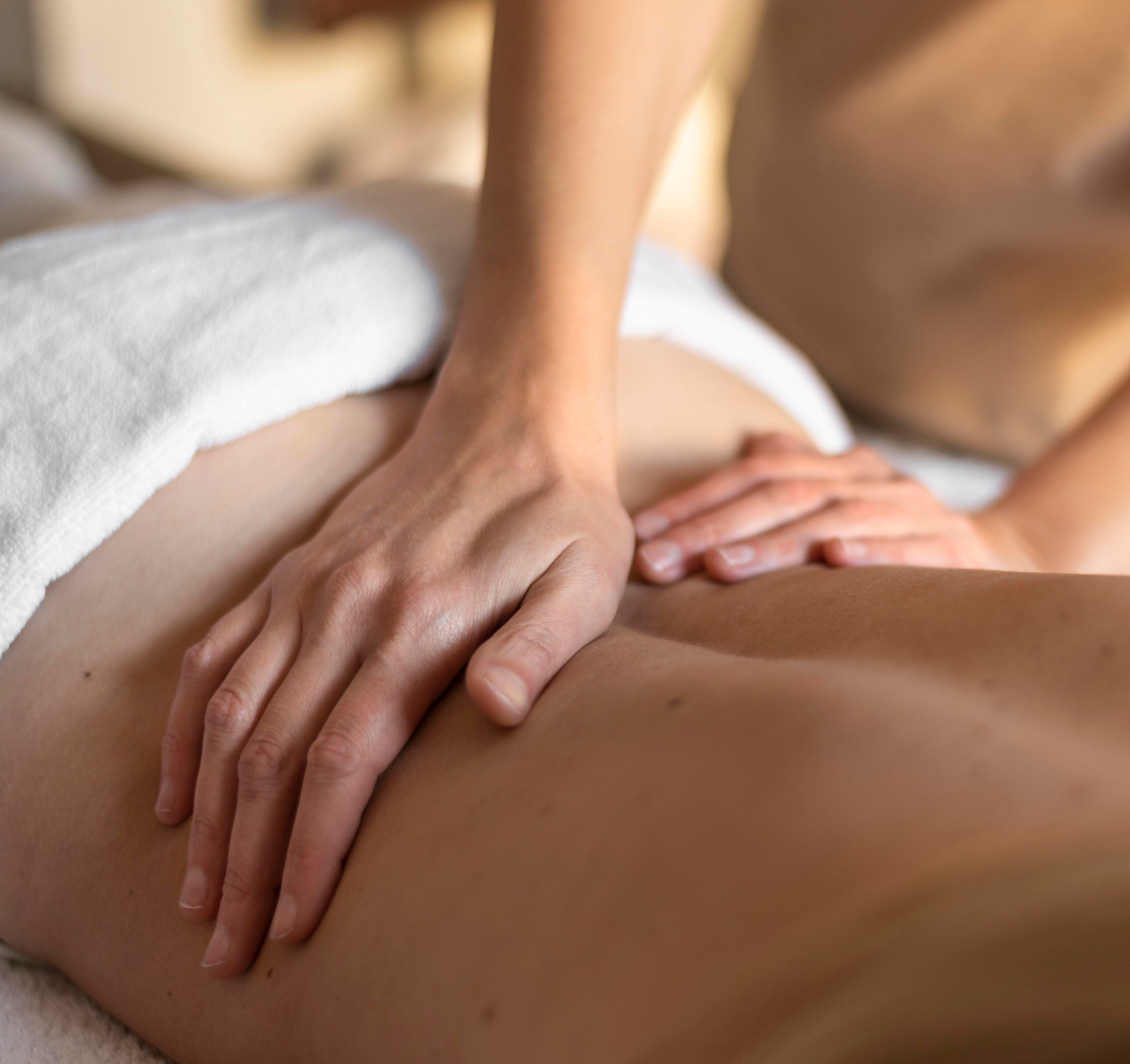 close-up-hands-massaging-person-s-back
